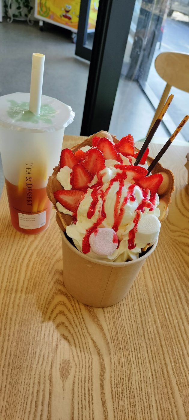 Dessert drink with whipped cream and strawberry sauce